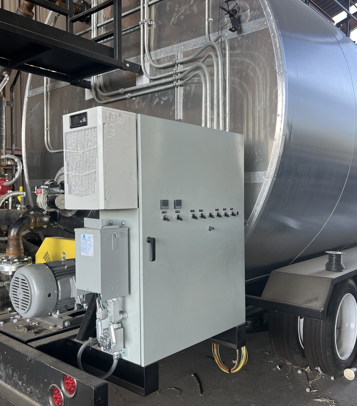 Custom-built electrical skid with control panel on a mobile process trailer